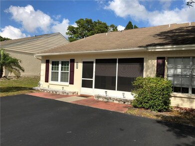 END VILLA WITH LARGE PARKING PAD AND SCREENED IN F
