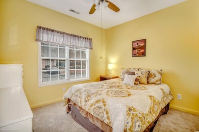 Bedroom featuring light carpet and ceiling fan