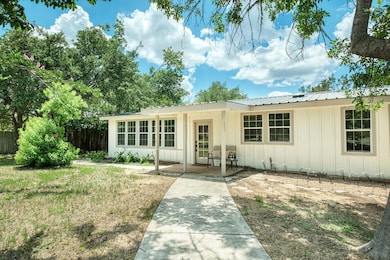 Single story home featuring board and batten sidi