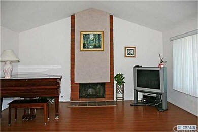 Living Room with Cathedral Ceiling, Fireplace, and