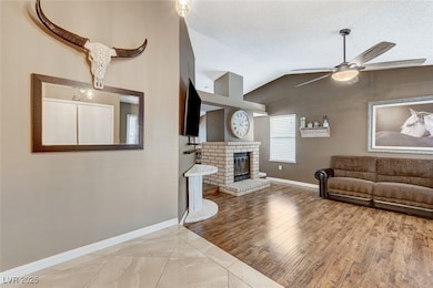Living room with vaulted ceiling, a textured ceili