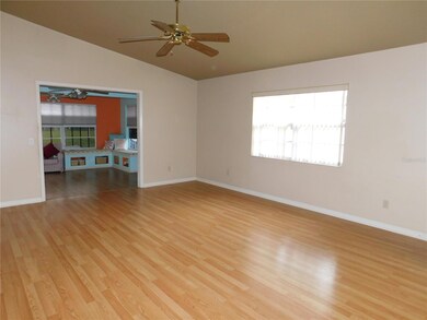 Living Room and view of Family Room, ceiling fan