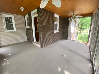 The screened-in back porch is a serene getaway or a gathering spot for friends.