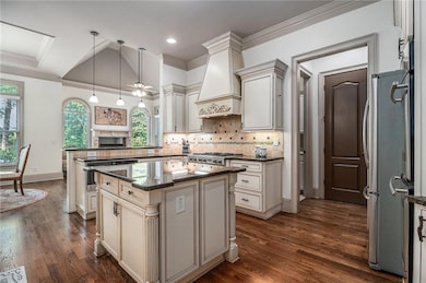 Kitchen with plenty of natural light, cream cabine