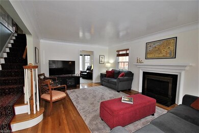 Large living room features a fireplace with classi