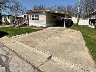 Room for 2 additional cars outside of carport in d