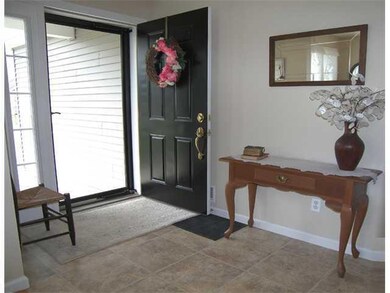 Foyer. Welcoming entry gives guests a spot to remo