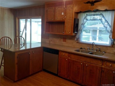 Bright and open kitchen opens to rear yard.