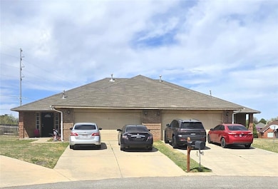 View of front of house featuring brick siding, dri