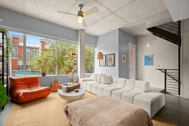 Living room with a ceiling fan and a wealth of na