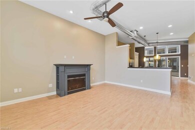 Industrial feel with high ceilings and exposed ductwork.