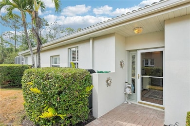 View of exterior entry featuring stucco siding