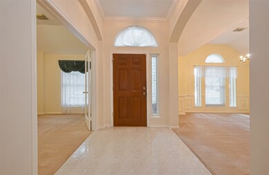 This inviting entryway features a warm wooden door