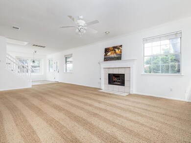 Unfurnished living room with a ceiling fan, a til