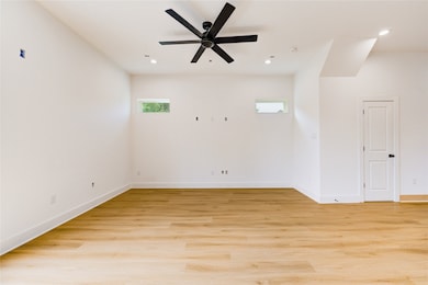 First floor living room with doors to the oversized backyard.