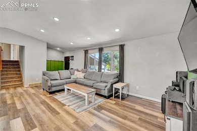 From the entry, luxury plank flooring and a stunni