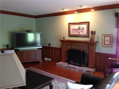 Family Room. Full Masonry Fireplace Gleams