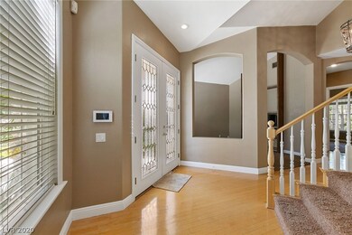 Double beveled glass door entry into Foyer with wo