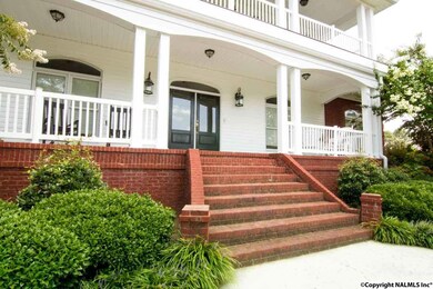 LARGE COVERED PORCH FOR WICKER FURNITURE AND SIPPING TEA.