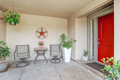 Lovely front entrance with some beautiful potted plants. One can enter through the patio also.