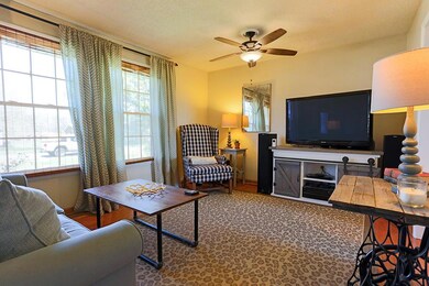 Hardwood floors and double windows are some of the gorgeous features in this den