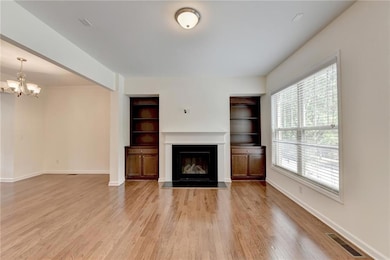 Unfurnished living room featuring an inviting chan