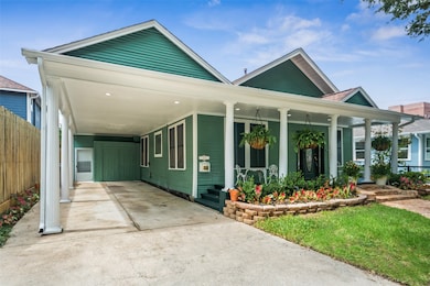 Side view of front of home shows detached carport