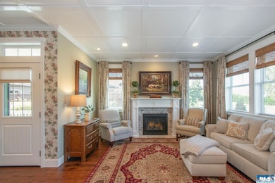 Cozy living room featuring a propane fireplace, perfect for warmth and ambiance year-round.