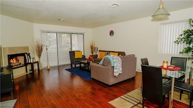 Living area featuring hardwood / wood-style floors
