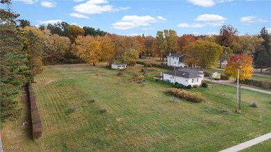Overview of rural landscape featuring a forest