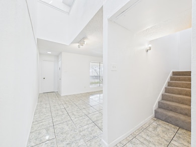 Stairs to Second Floor w/Powder Room