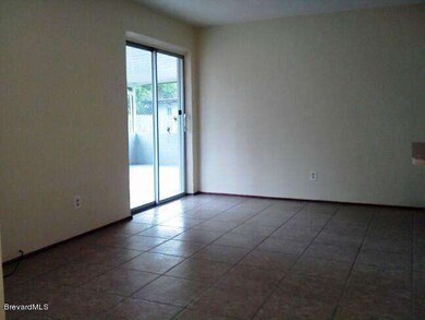 Sliding door off Newly Tiled Living Room