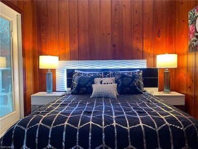 Bedroom with wooden walls