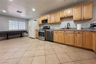 Kitchen with appliances with stainless steel finis