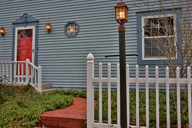 Lovely brick lined entrance with garden lighting
