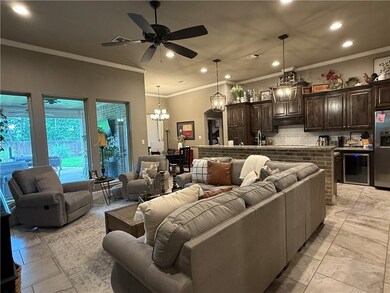 Living area featuring recessed lighting, beverage