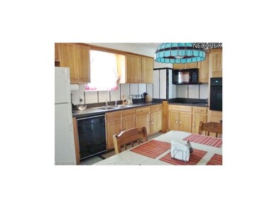 The oak kitchen includes all appliances and was up