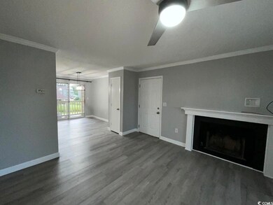 Unfurnished living room with ceiling fan, dark har