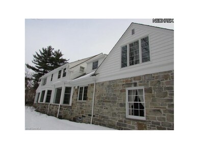 Expansive view of rear of home. Many newer windows