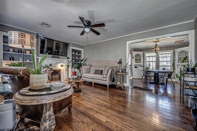 Step into the home. The living room with it's book cases and dining space with corner cabinets are ready to host friends and family.