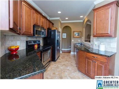 The efficient, galley style kitchen features attra