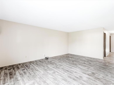 Spare room with wood finished floors