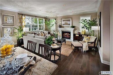 Open floor plan living and dining room (photo is o