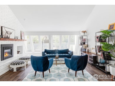 Off the entry, the light-filled vinyl room showcases slanted windows and a floor-to-ceiling stone fireplace-an inviting spot to unwind or gather.