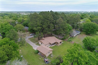 Aerial view of almost half acre lot, house & carpo
