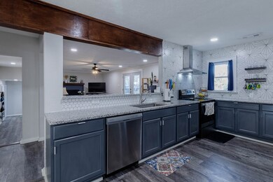 Open kitchen, granite counters, gorgeous accent ba