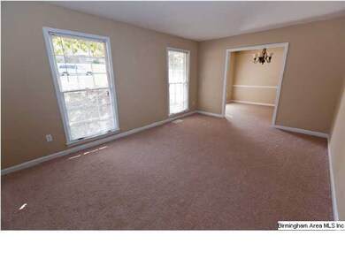 Living Room with new painbt and new carpet through