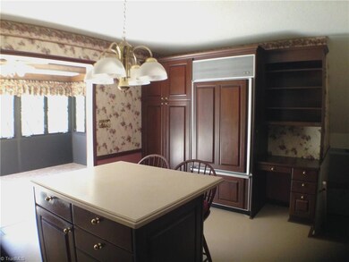 Kitchen leads into the sunroom
