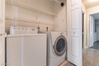 Laundry area with washing machine and clothes drye