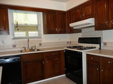Kitchen. Beautiful cabinets, ceramic tile floor.